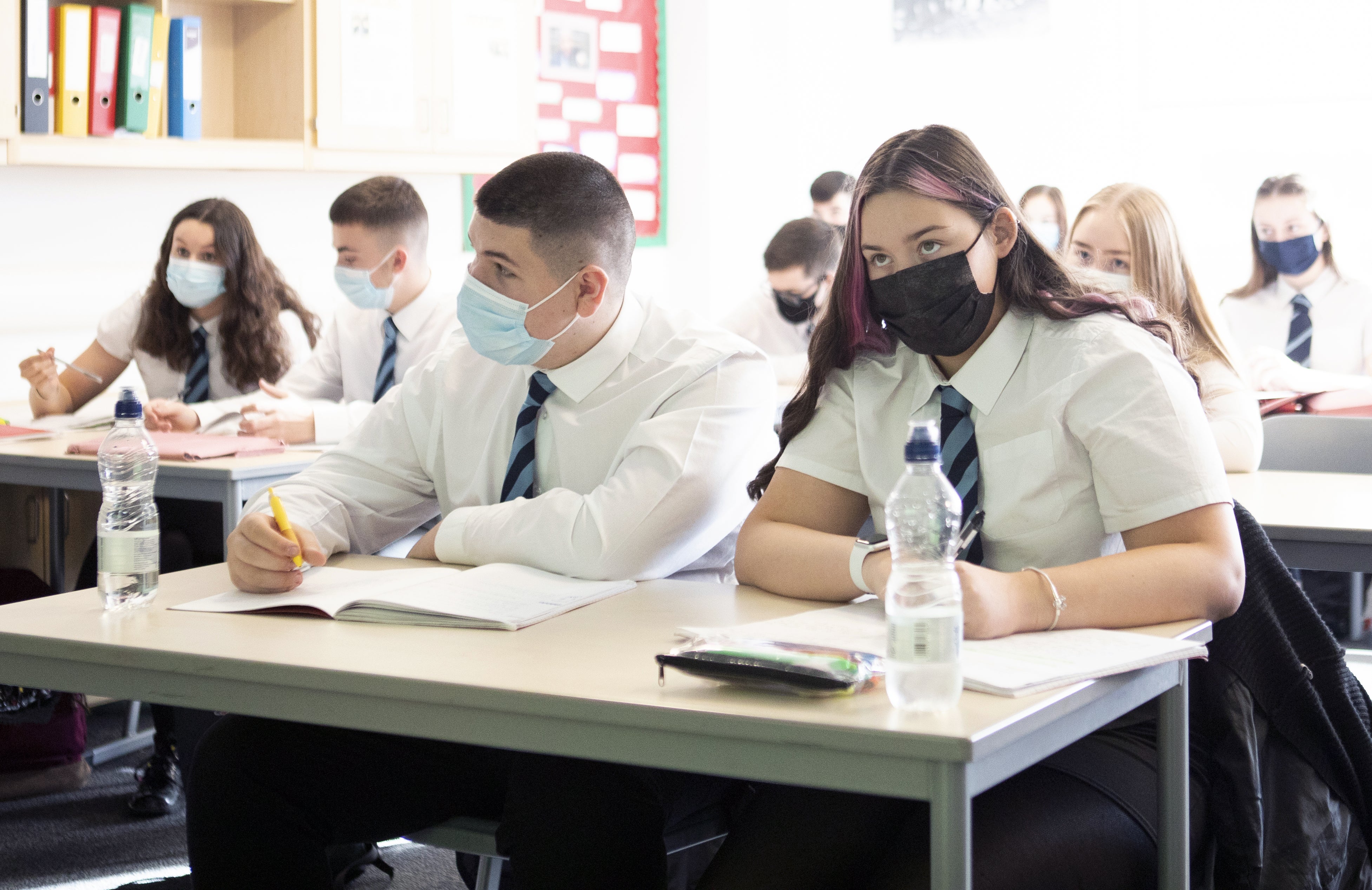 Pupils wearing face masks in class (PA)