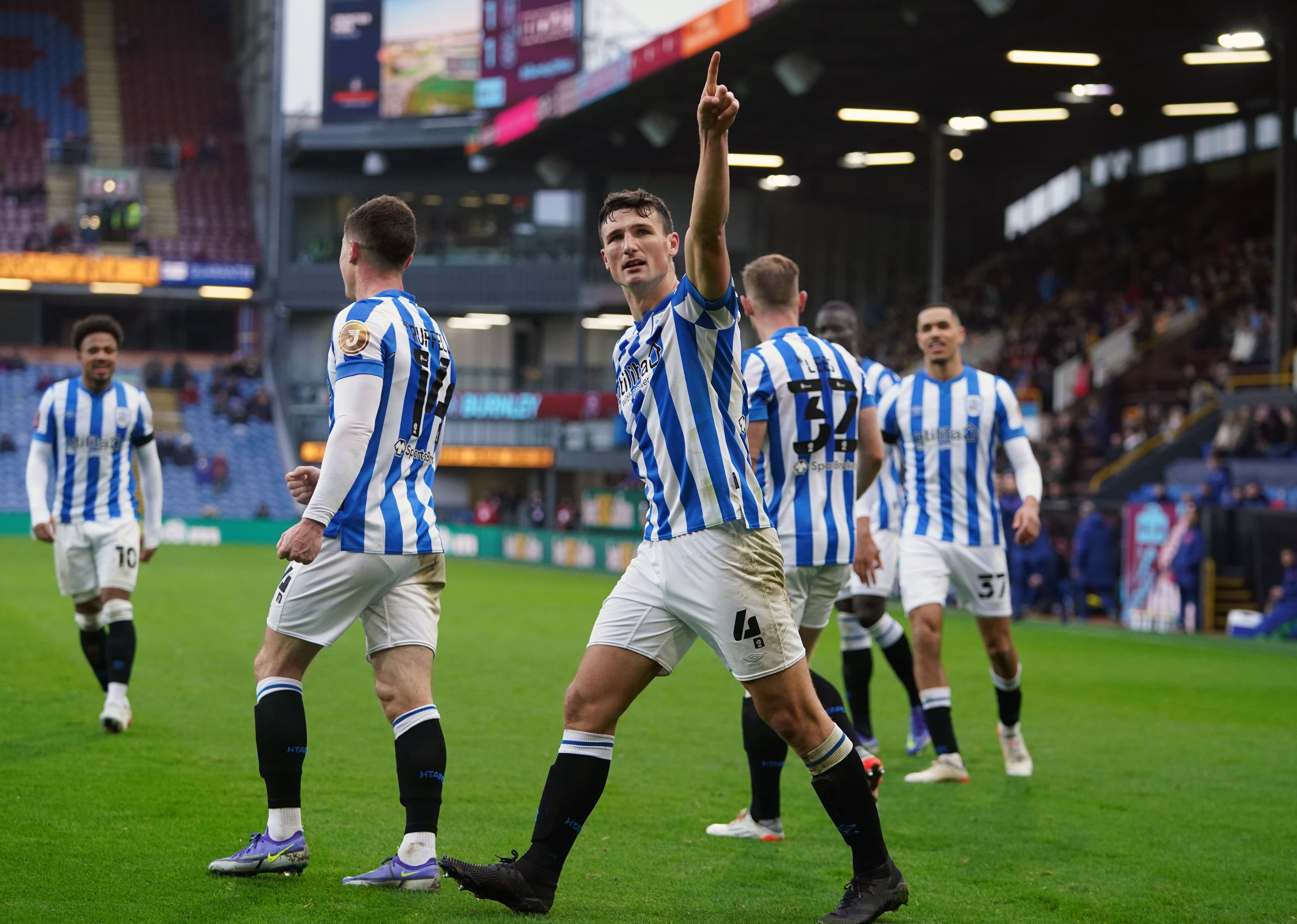 Huddersfield’s Matty Pearson celebrates scoring the winner at Burnley (PA)
