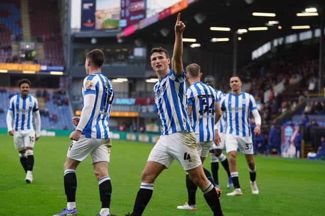 Huddersfield’s Matty Pearson celebrates scoring the winner at Burnley (PA)