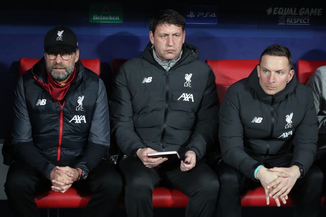 <p>Liverpool assistant coach Peter Krawietz, centre, has been holding fort in the absence of Jurgen Klopp, left, and Pepijn Lijnders (Nick Potts/PA)</p>