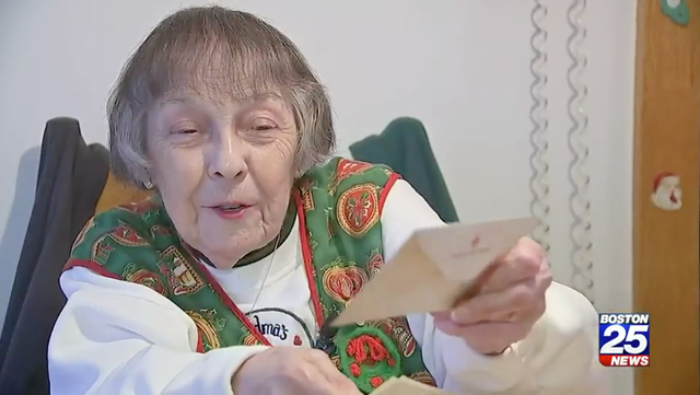 <p>Angelina Gonsalves, 89, shows the letter she received from her husband, US Army Sgt John Gonsalves, 76 years after he wrote it</p>