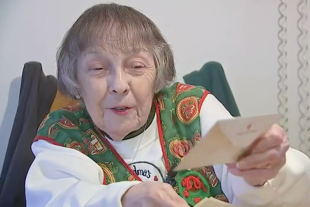 <p>Angelina Gonsalves, 89, shows the letter she received from her husband, US Army Sgt John Gonsalves, 76 years after he wrote it</p>