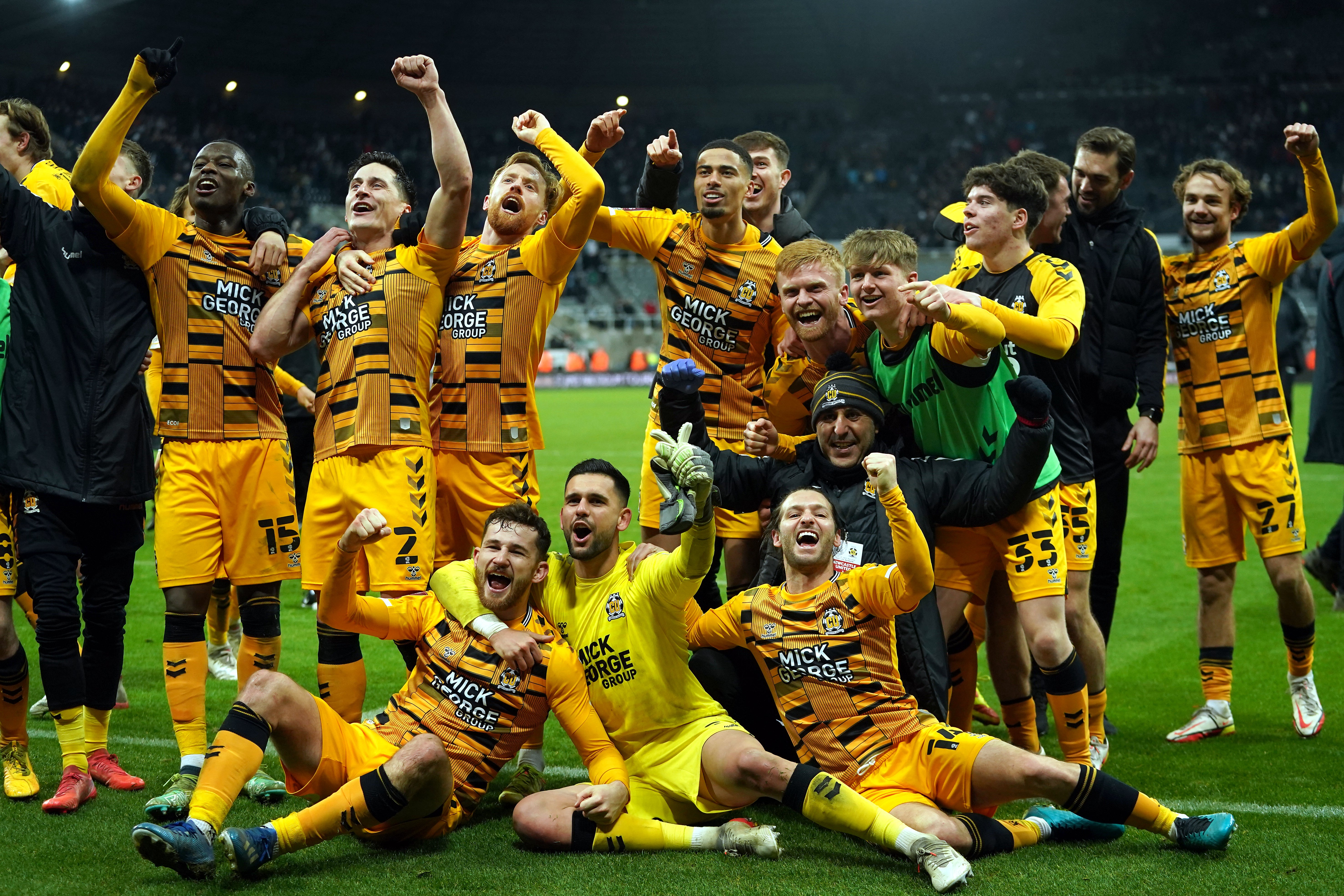 Cambridge players celebrate victory against Newcastle (Owen Humphreys/PA)