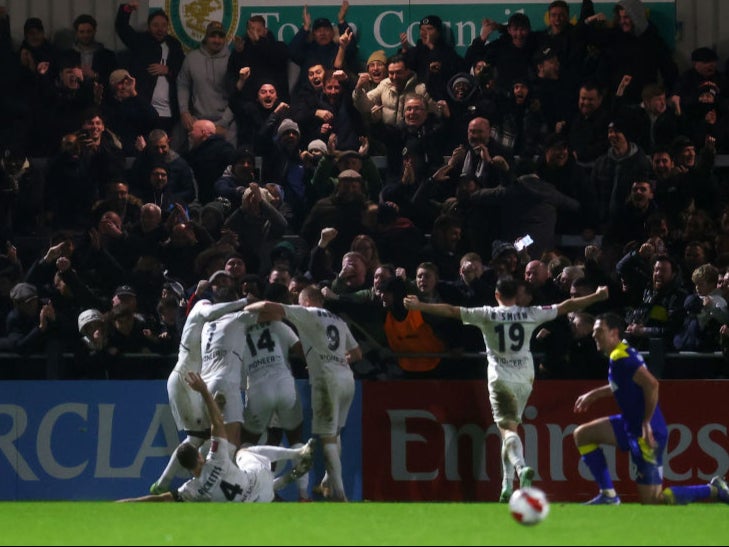 Boreham Wood celebrate during victory against AFC Wimbledon