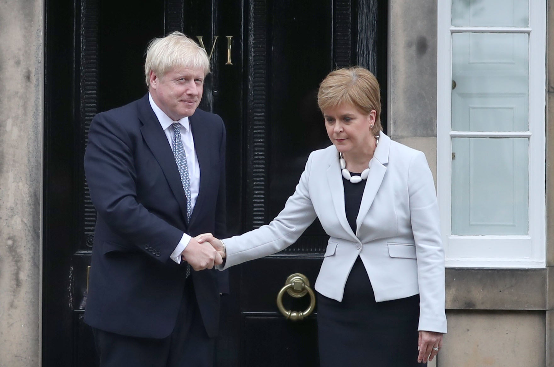 Scotland’s First Minister Nicola Sturgeon with Prime Minister Boris Johnson (Jane Barlow/PA)