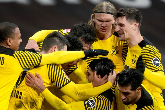 Dortmund celebrated a memorable Bundesliga win over Eintracht Frankfurt after recovering from 2-0 down (Michael Probst/AP)