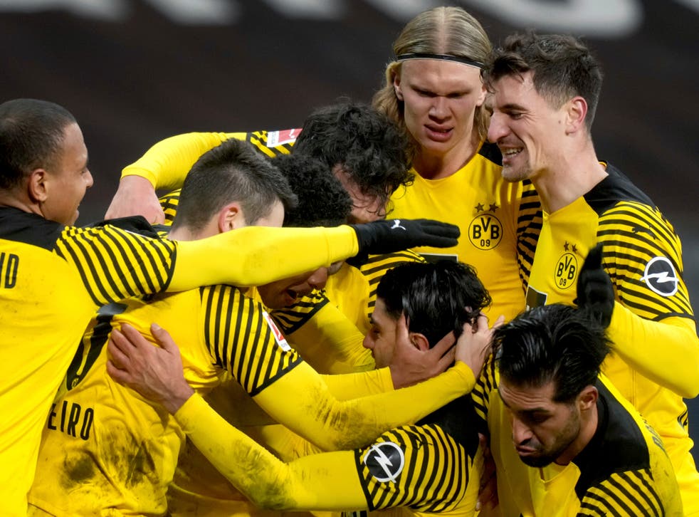 Dortmund celebrated a memorable Bundesliga win over Eintracht Frankfurt after recovering from 2-0 down (Michael Probst/AP)