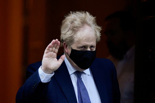 <p>Prime minister Boris Johnson gestures as he leaves Downing Street to attend Prime Minister's Questions in parliament</p>