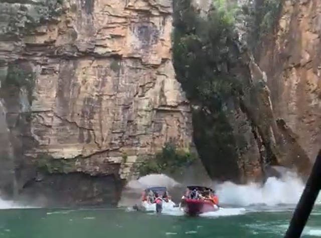 <p>Videos showed a slab of canyon wall falling onto motorboats in Minas Gerais, Brazil</p>