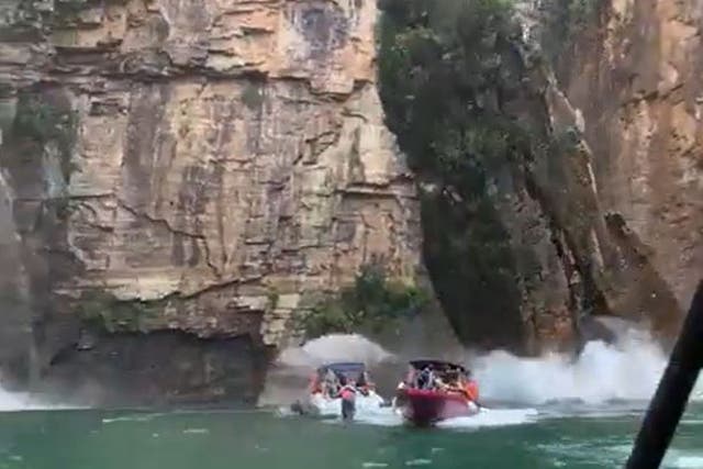 <p>Videos showed a slab of canyon wall falling onto motorboats in Minas Gerais, Brazil</p>