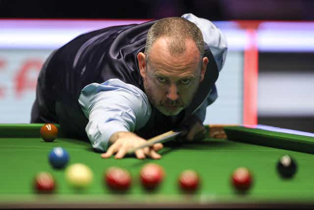 Mark Williams plays a shot during his 6-4 win over defending champion Yan Bingtao on day one of the 2022 Cazoo Masters (Kieran Cleeves/PA)