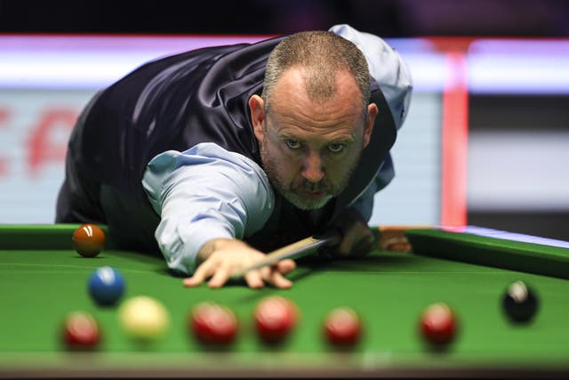 Mark Williams plays a shot during his 6-4 win over defending champion Yan Bingtao on day one of the 2022 Cazoo Masters (Kieran Cleeves/PA)