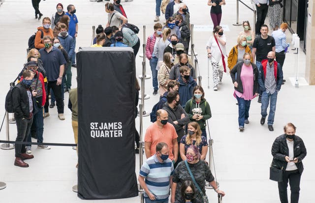 People queue for shops at the opening of the St James Quarter shopping centre in Edinburgh (PA)