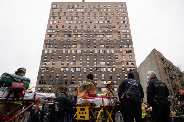 Emergency personnel work at the scene of a fatal fire at an apartment building in New York (AP Photo/Yuki Iwamura)