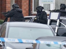 Armed police in standoff with man refusing to leave home with eight-year-old son