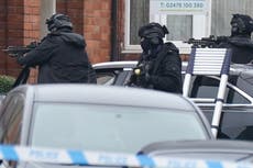 Armed police in standoff with man refusing to leave home with eight-year-old son