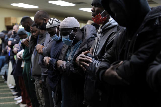 <p>People take part in the evening prayer at the Masjid Ar Rahmah, a mosque close to the multi-level apartment building that was the scene of a fire in the Bronx</p>