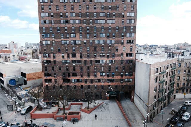 <p>The Bronx apartment building a day after a fire swept through the complex killing at least 17 people and injuring dozens of others</p>