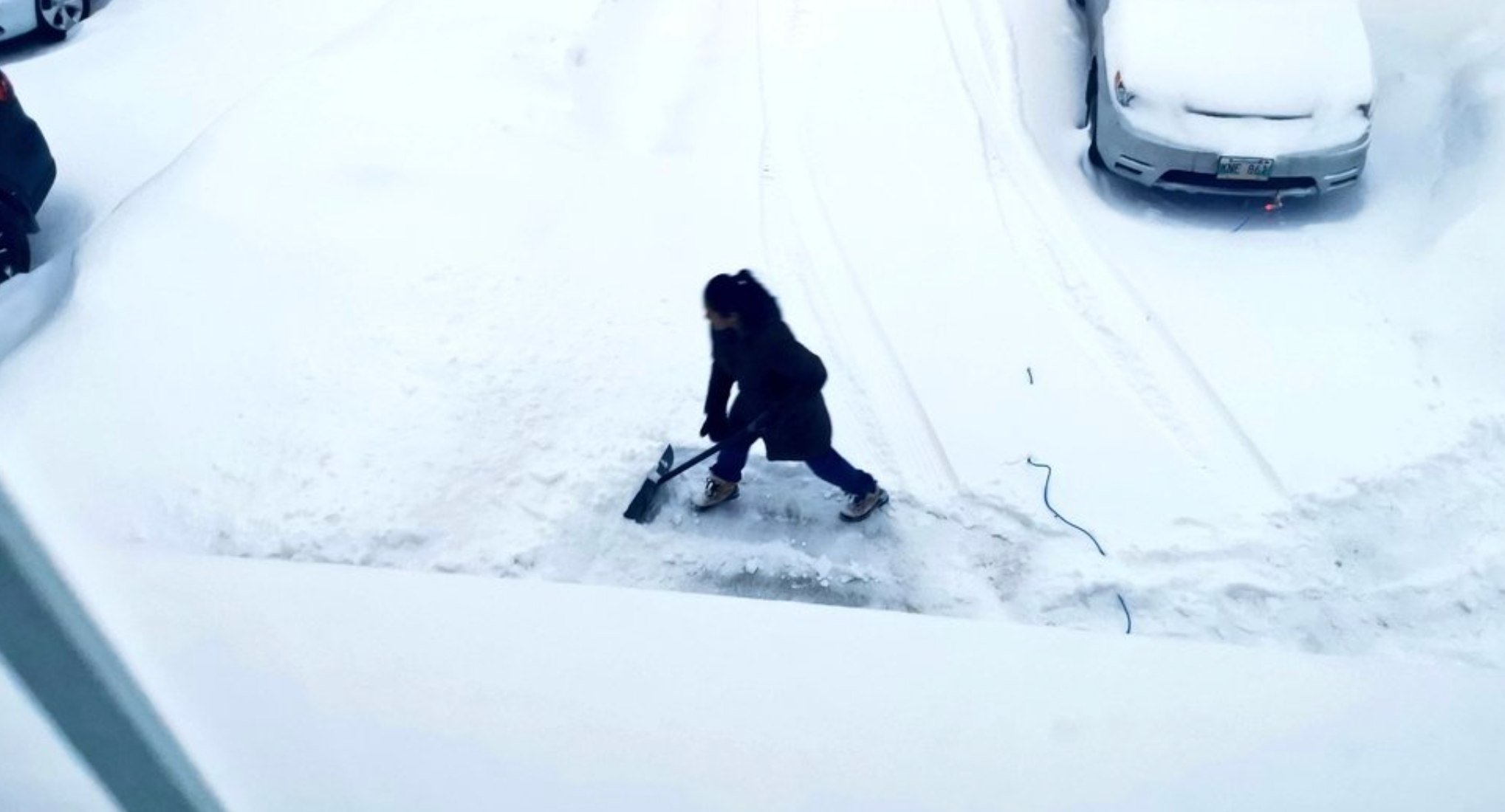 Jon Reyes shared a photo of his wife shovelling snow in their driveway