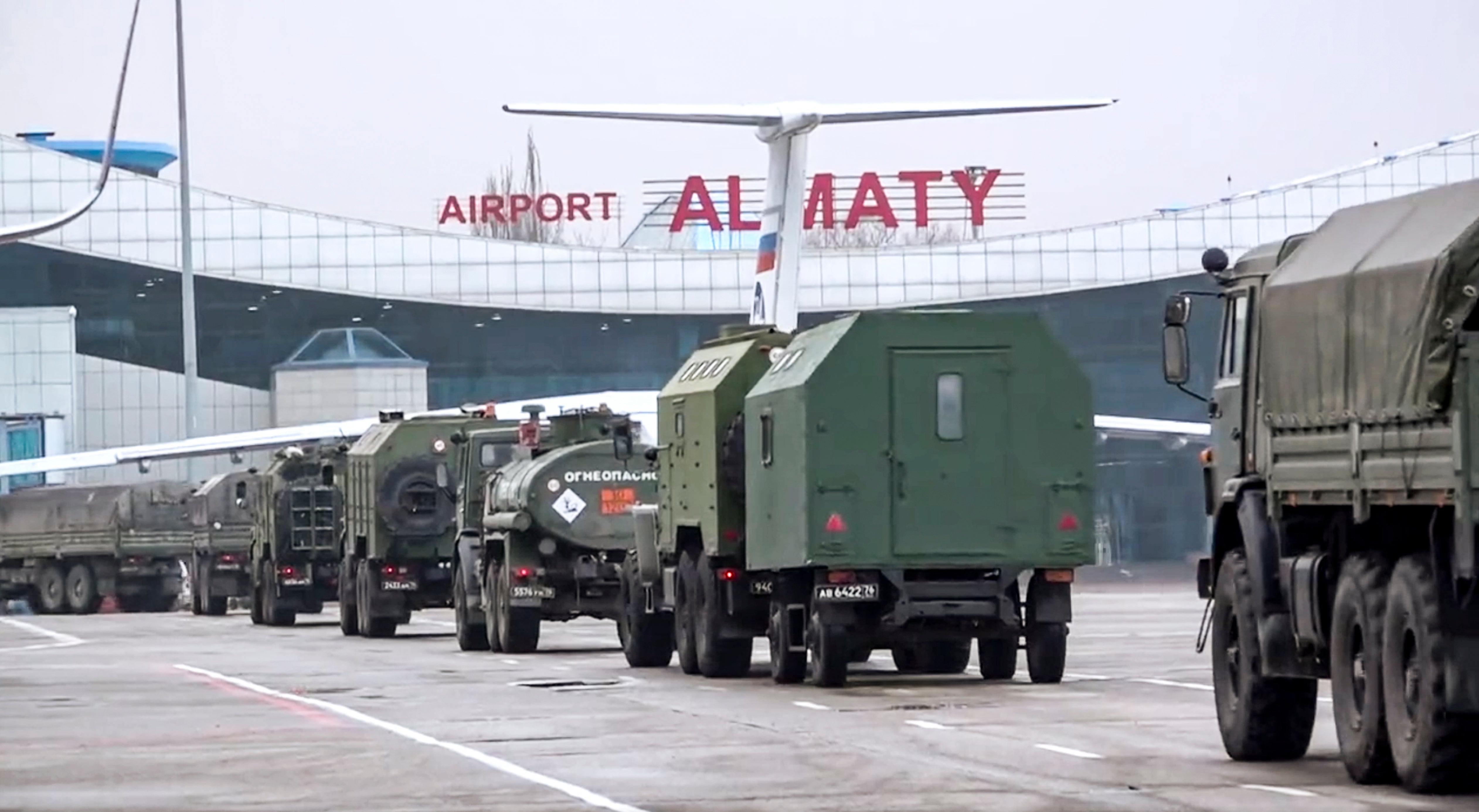 Pictures from the Russian Defence Ministry show vehicles of Russian troops leaving an airport in Almaty, Kazakhstan, Sunday, Jan. 9, 2022.