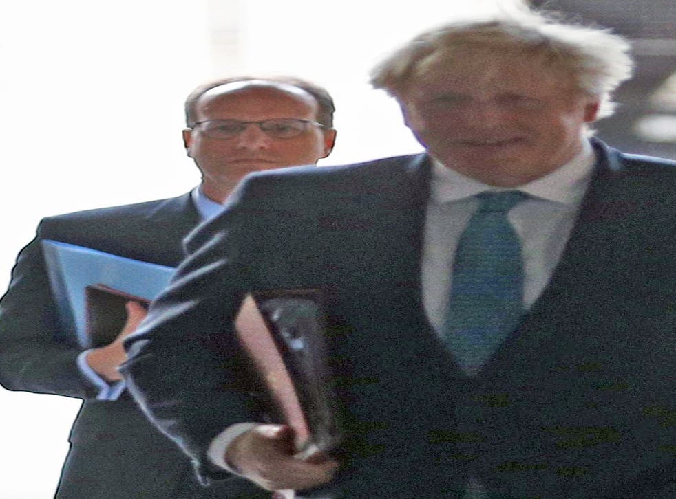 Martin Reynolds (left) and Boris Johnson walking back to Downing Street after a cabinet meeting