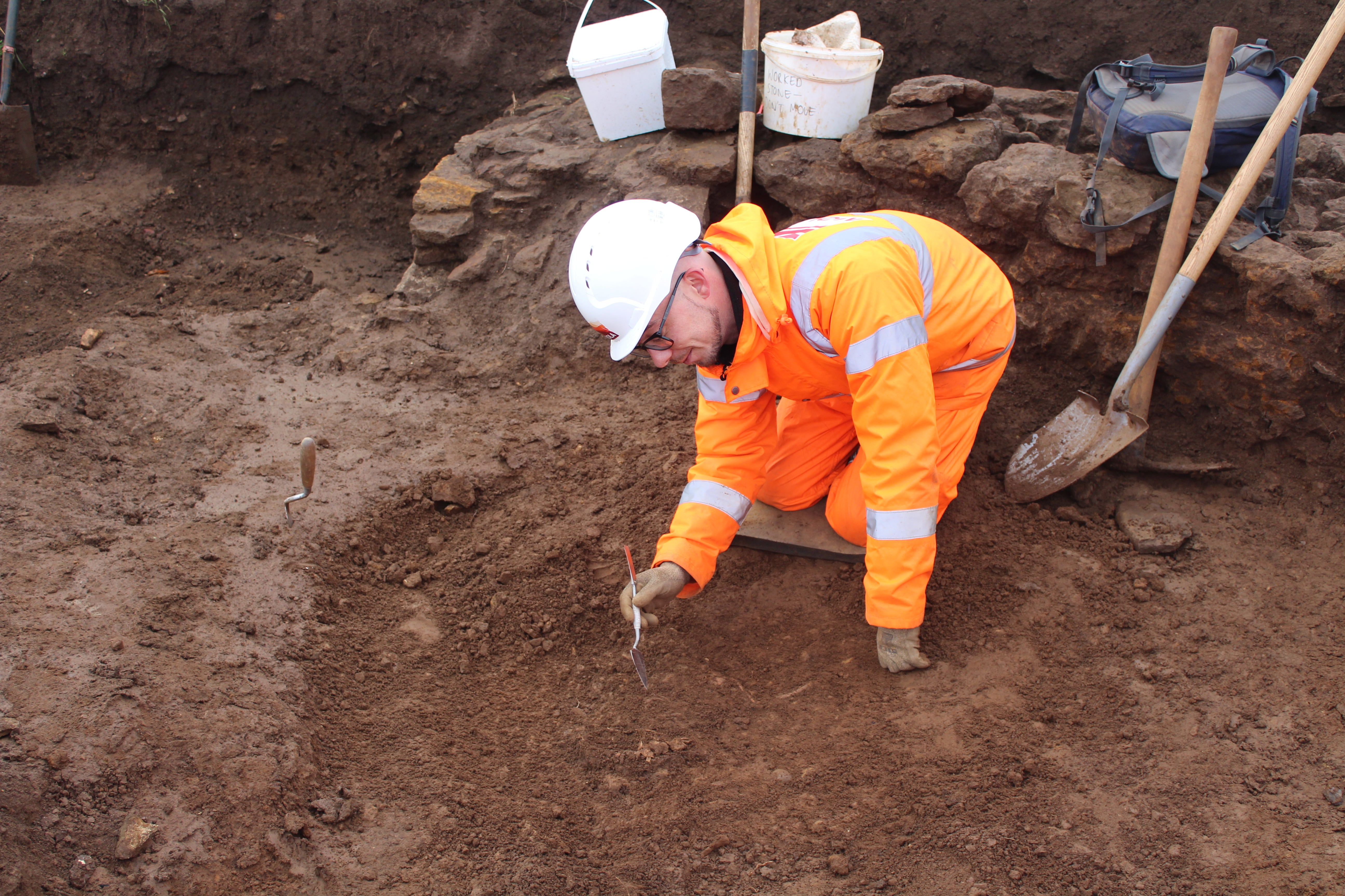 An archaeologist uncovers a child burial