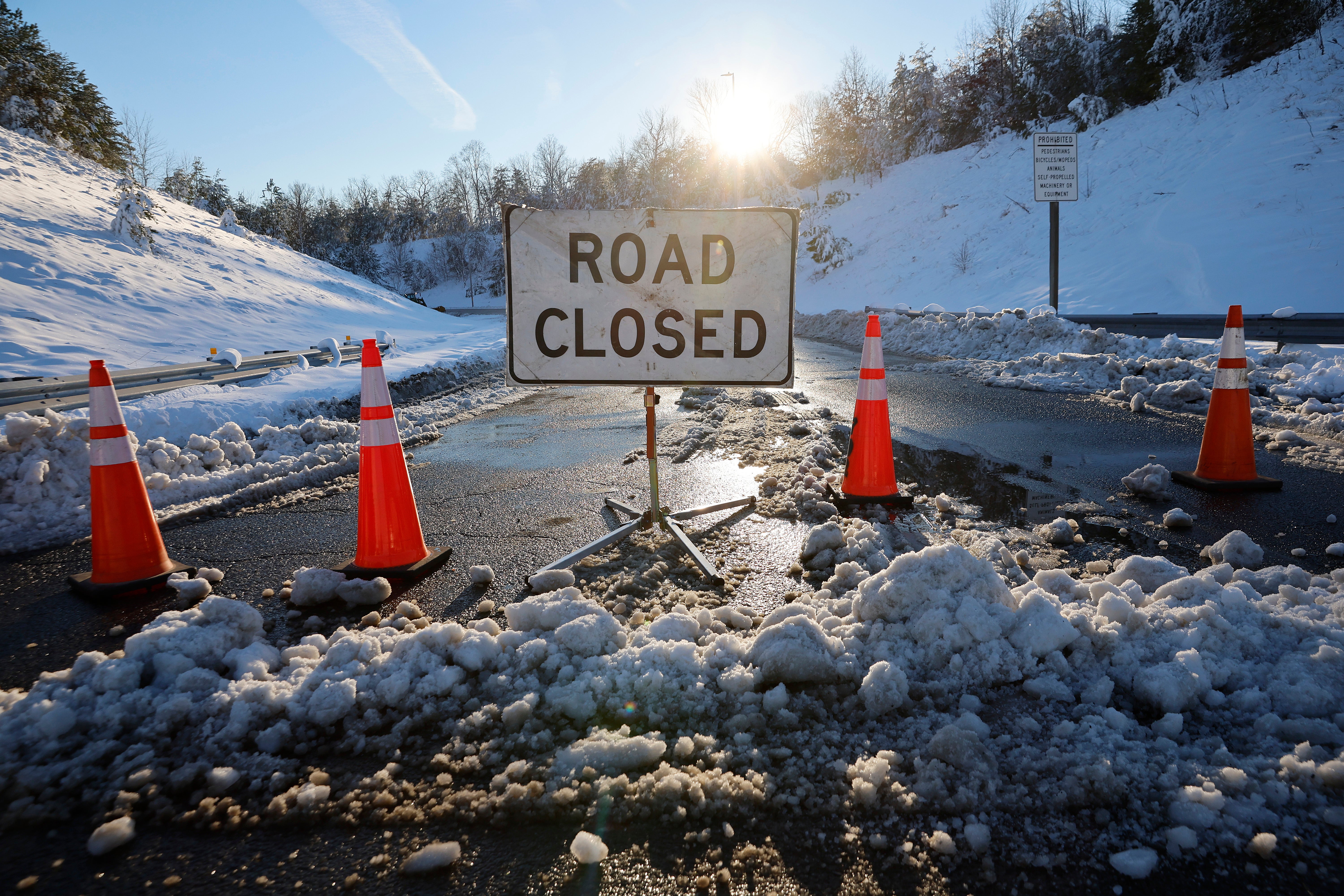 A winter storm with record snowfall slammed into the Mid-Atlantic states, stranding thousands of motorists overnight on 50 miles of I-95 in Virginia