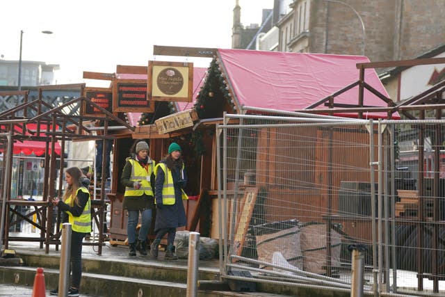 Set construction build a Christmas market in the Trongate area of Glasgo (Andrew Milligan/PA)