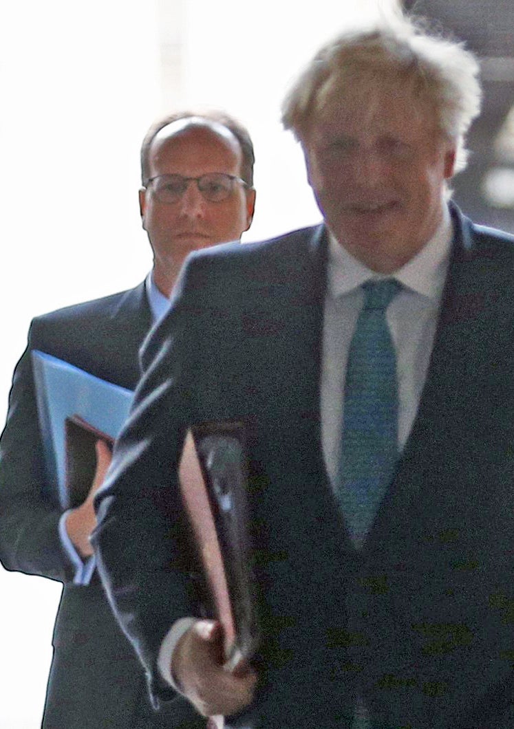 Martin Reynolds, principal private secretary and prime minister Boris Johnson, walking back to Downing Street after a cabinet meeting