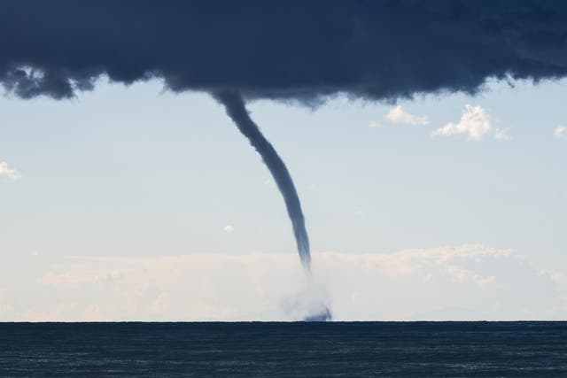 <p>A tornado over the Mediterranean Sea. The climate crisis is warming oceans, making extreme weather more likely</p>