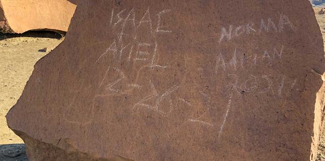 <p>The vandalism on a petroglyph</p>