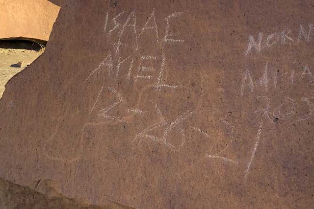 <p>The vandalism on a petroglyph</p>