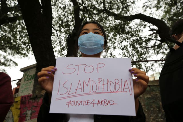<p>File. A woman holds a placard during a protest against the killing of a Muslim man in Belagavi district of the southern Indian state of Karnataka, in Bengaluru, India, Tuesday, 5 October 2021</p>