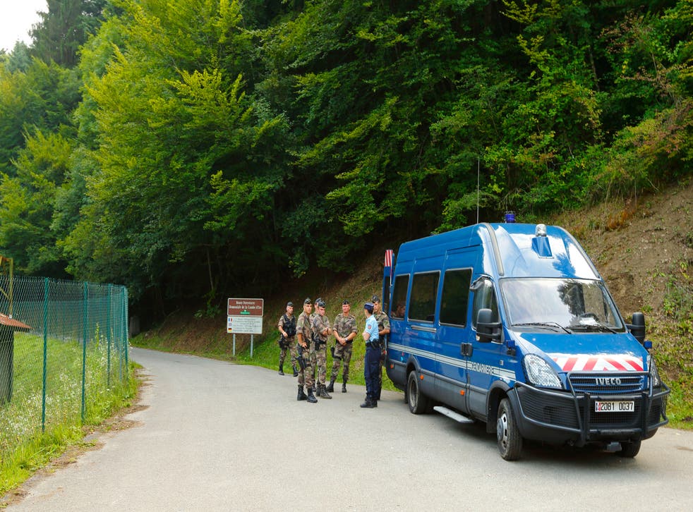 French police guard the road to the murder scene near Annecy in September 2012 (Chris Ison/PA)