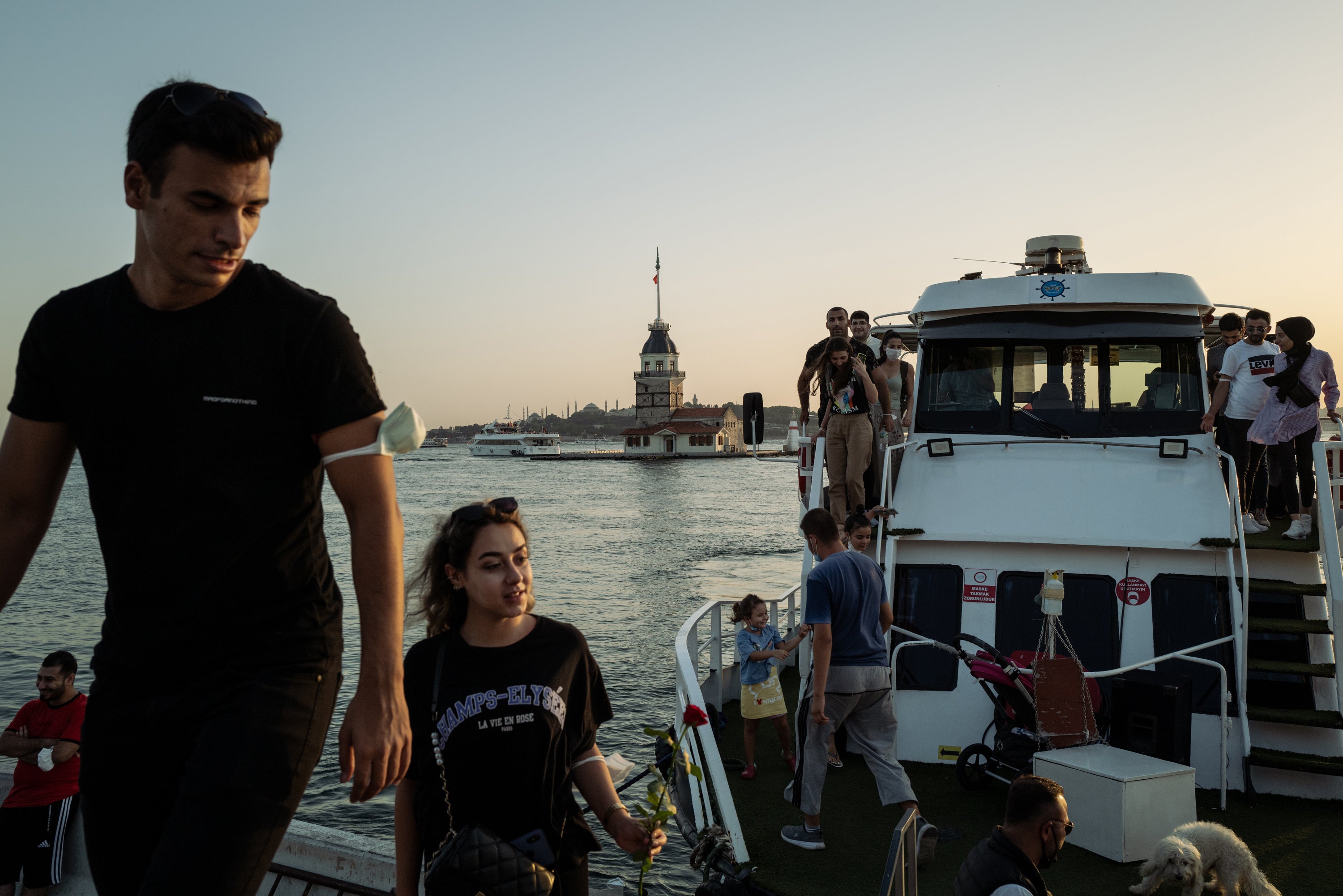 Passengers leave a ferry in the shadow of Maiden’s Tower, a garrison and a ship station on the Bosporus