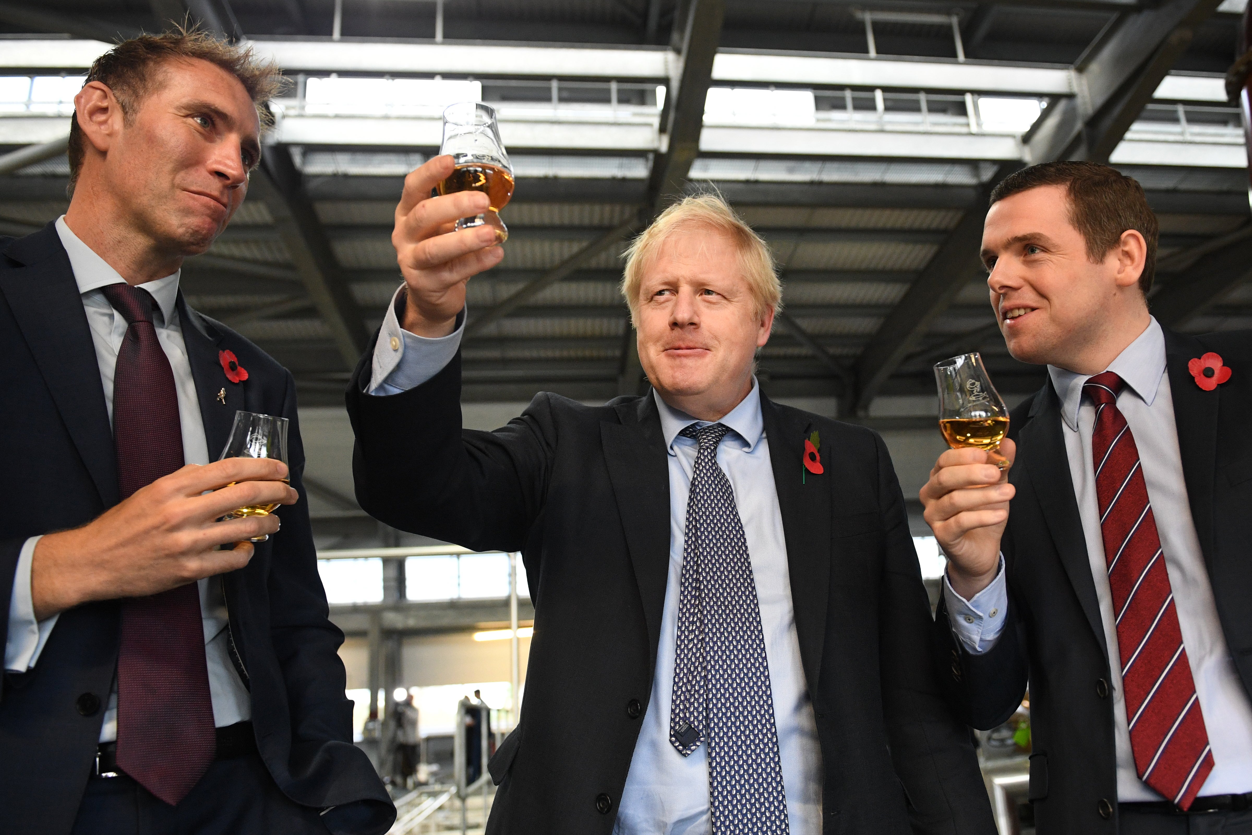 Scottish Tory leader Douglas Ross (right) has called for Boris Johnson (centre) to quit (Stefan Rousseau/PA)
