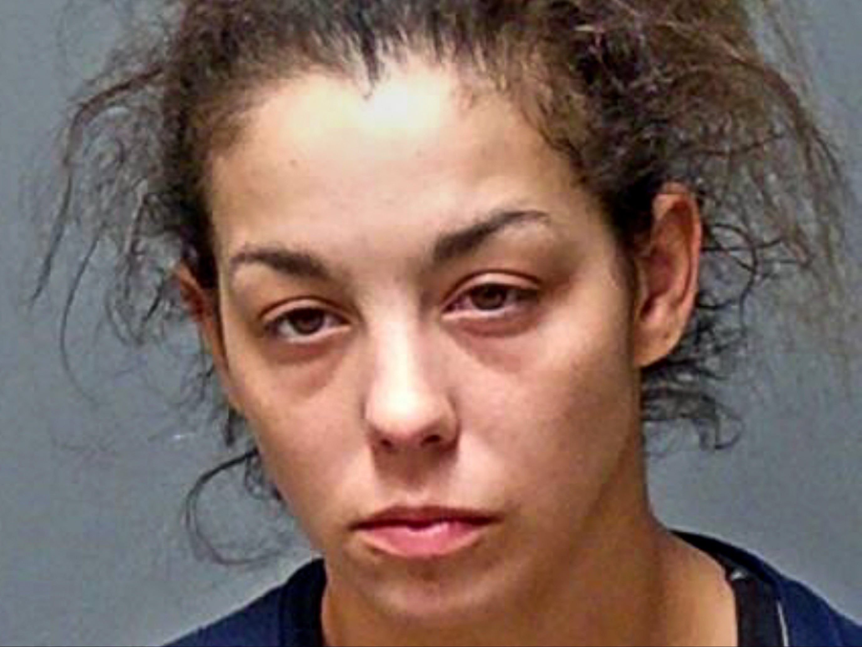 <p>This booking photograph provided by the N.H. Attorney General's office shows Kayla Montgomery, 31, of Manchester, New Hampshire, who was arrested on January 5, 2022</p>