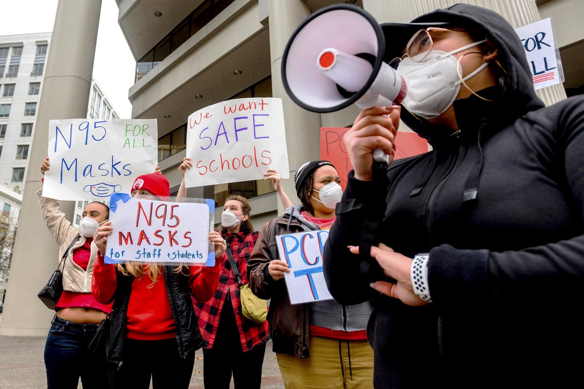 Soaring COVID-19 cases renew US debate over mask mandates | The Independent