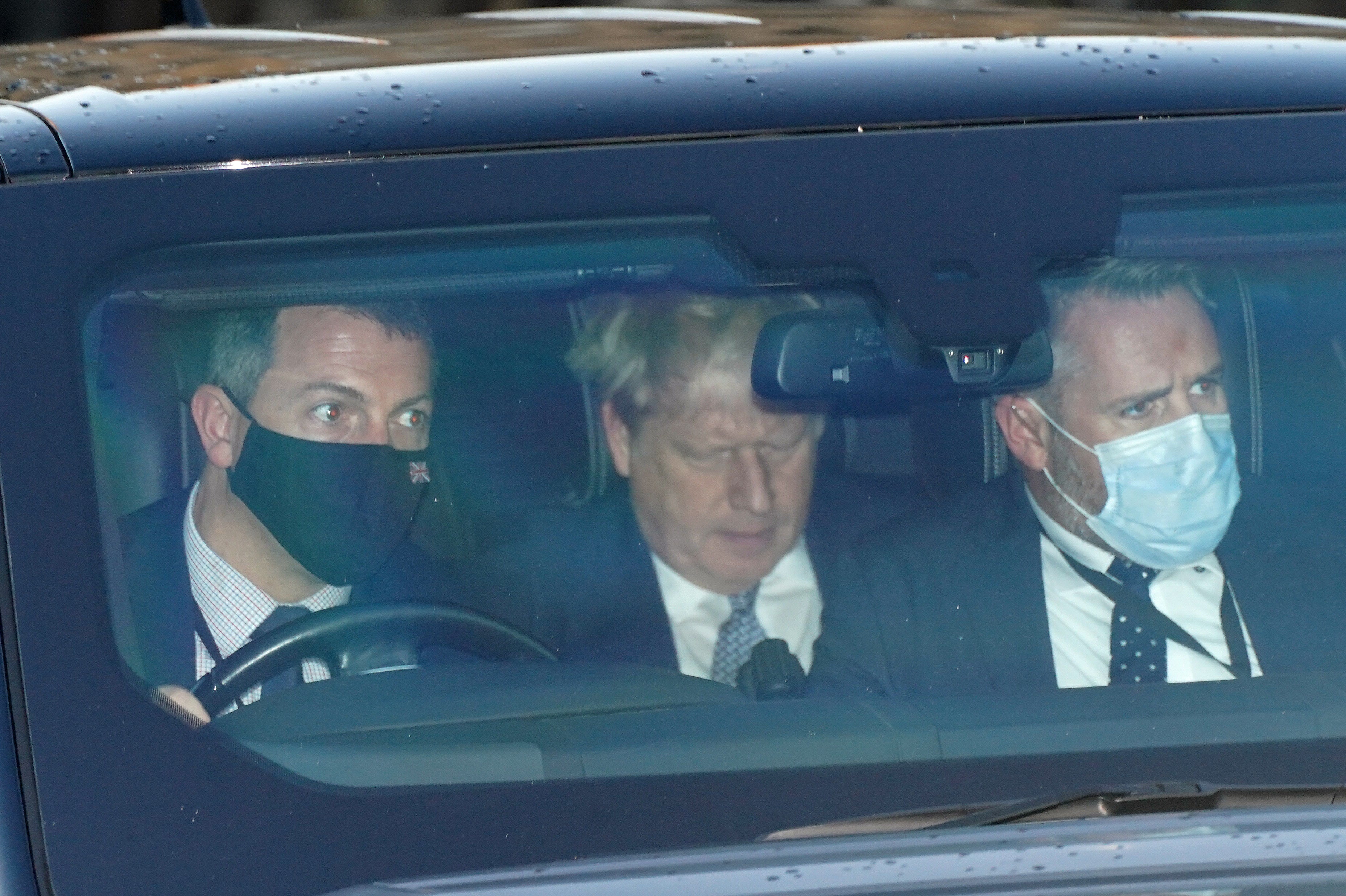 Prime Minister Boris Johnson (centre) leaves the Houses of Parliament in Westminster. (Stefan Rousseau/PA)