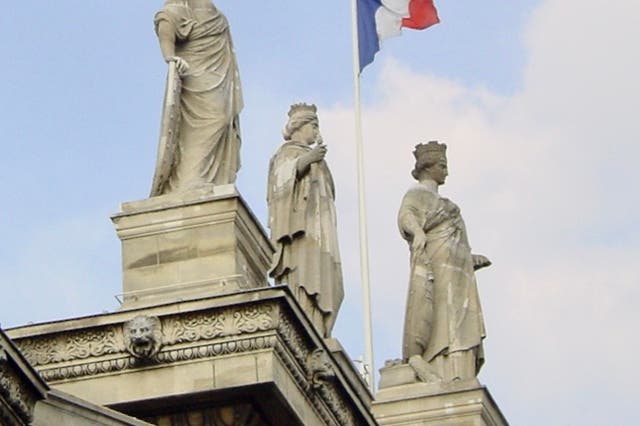 <p>Out of reach: statues on the façade of Paris Gare du Nord, terminus for Eurostar trains from London – with cancellations due to strikes </p>
