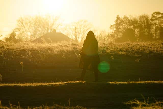 <p>A person walks across Basingstoke Common in Basingstoke, Hampshire. Picture date: Thursday 13 January, 2022. </p>