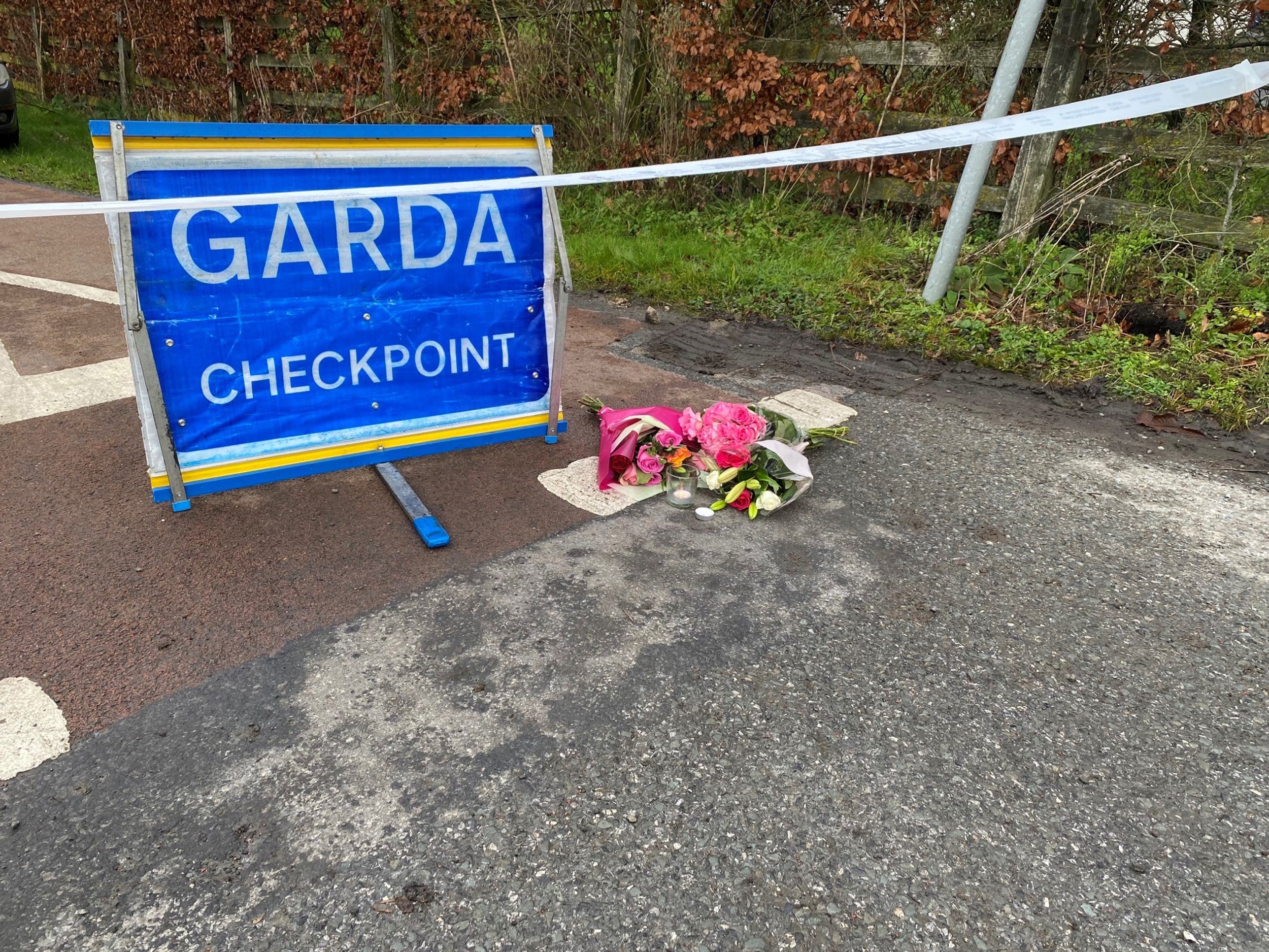 Flowers were left at a Garda checkpoint after the primary school teacher’s death (Dominic McGrath/PA)