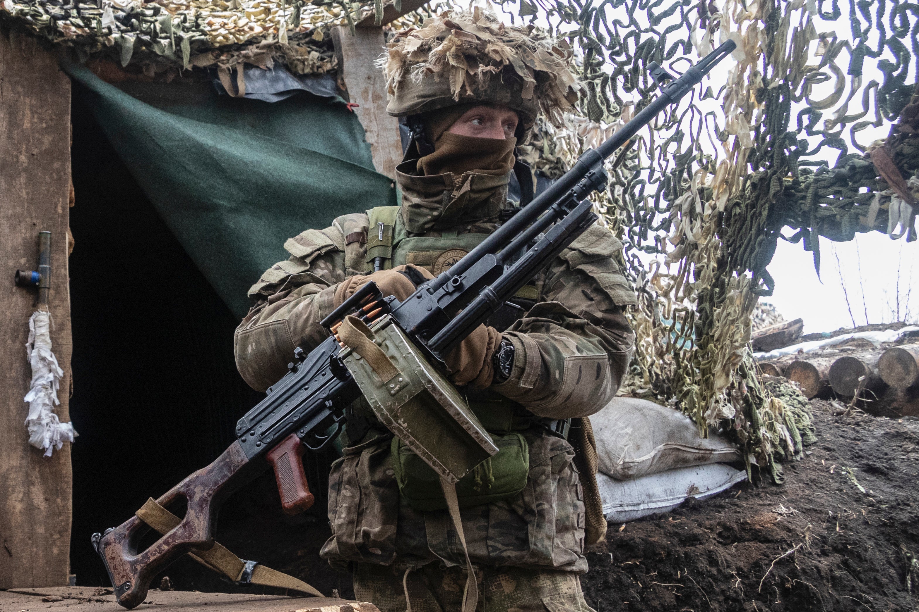 A Ukrainian soldier stands at the line of separation from pro-Russian rebels, Donetsk region, Ukraine, 10 January 2022