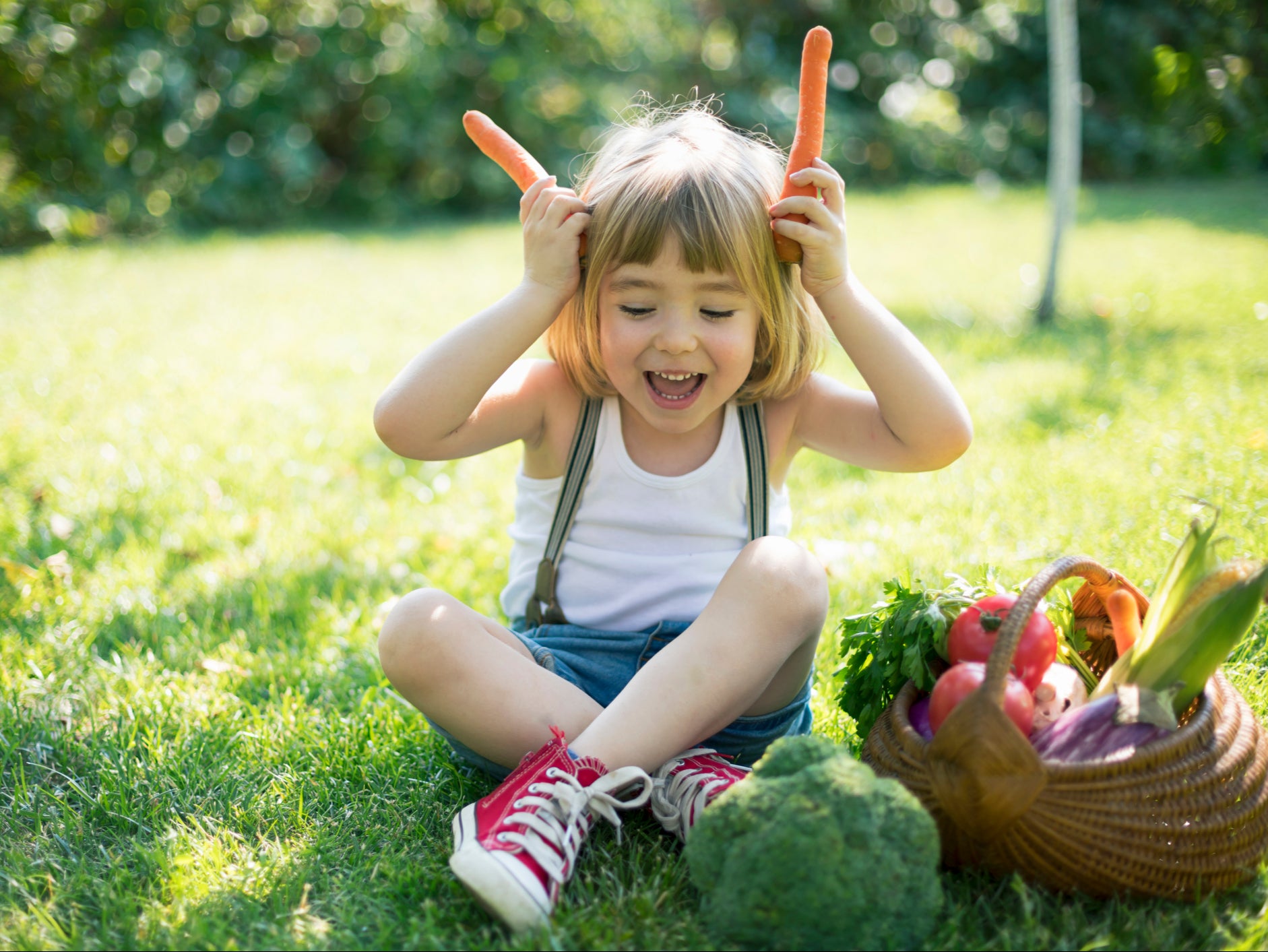 A young girl with a basket of vegetables