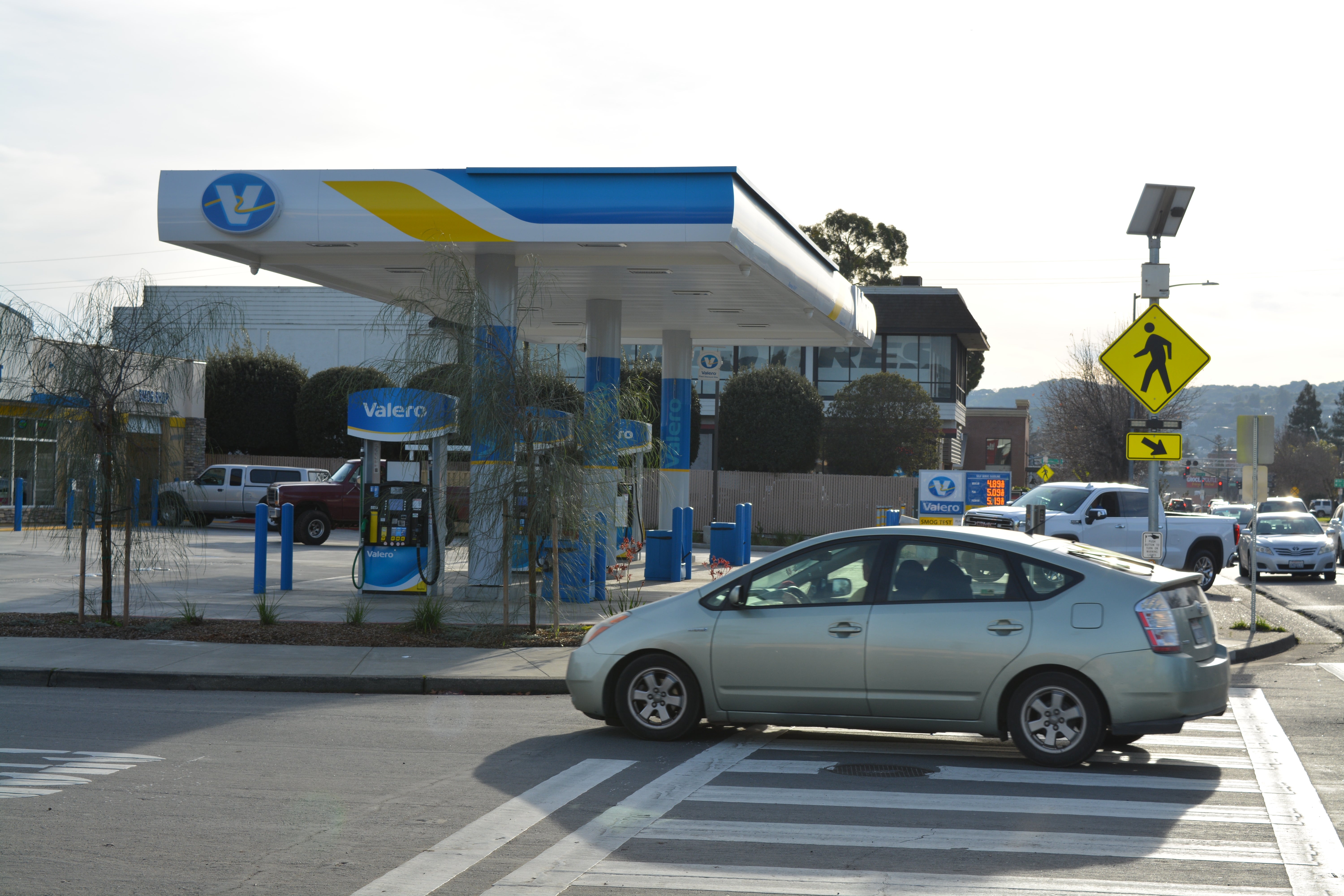 Cars drive past a gas station in Petaluma, California, on 11 January, 2021. The city is the first in the nation to outlaw construction of new gas stations.