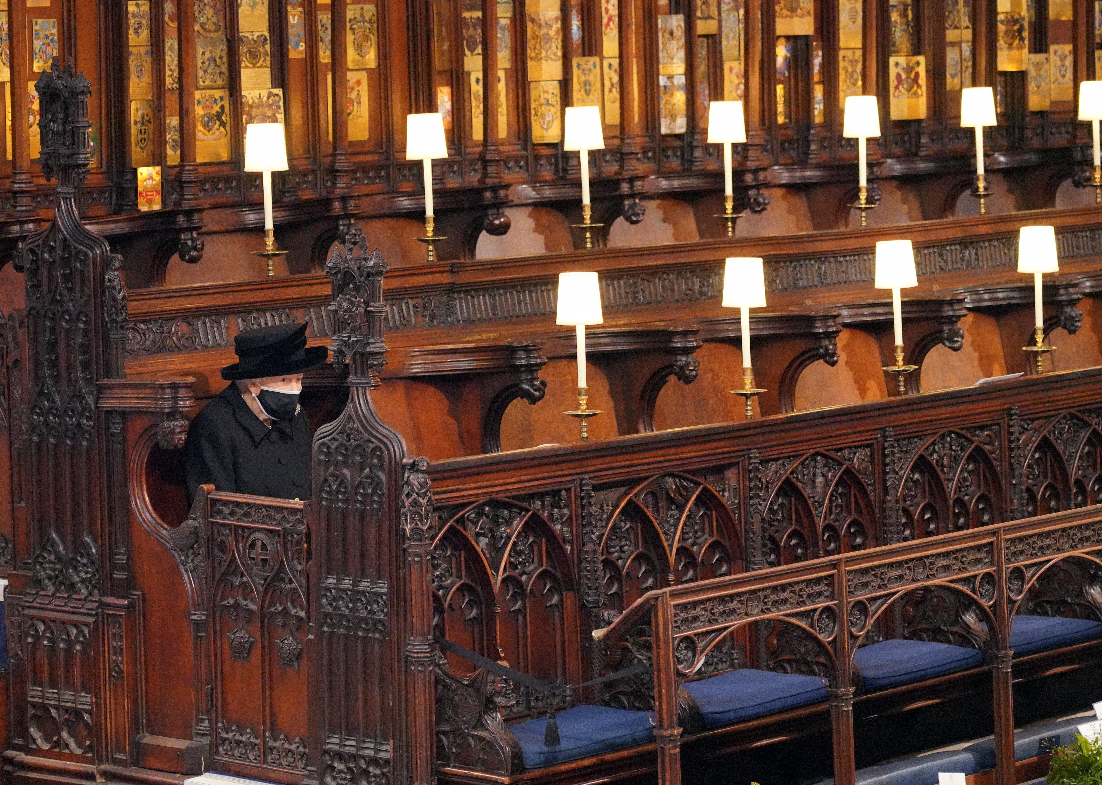 <p>The Queen at the funeral of her husband, the Duke of Edinburgh, in St George’s Chapel, Windsor Castle, last April</p>