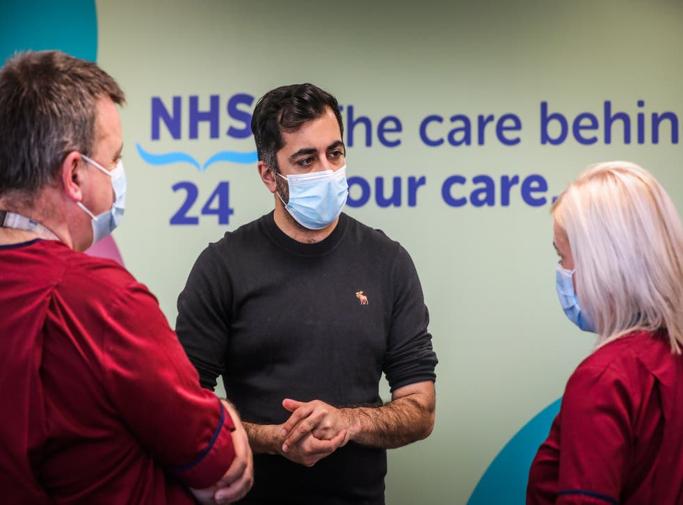 Humza Yousaf meets clinical services managers Billy Togneri and Julie Lindsay during a visit to the new NHS 24 call centre (Mhairi Edwards/The Courier/PA)