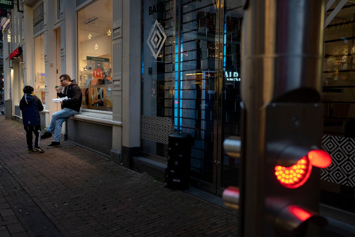 In southern Dutch town, cafes open in lockdown protest