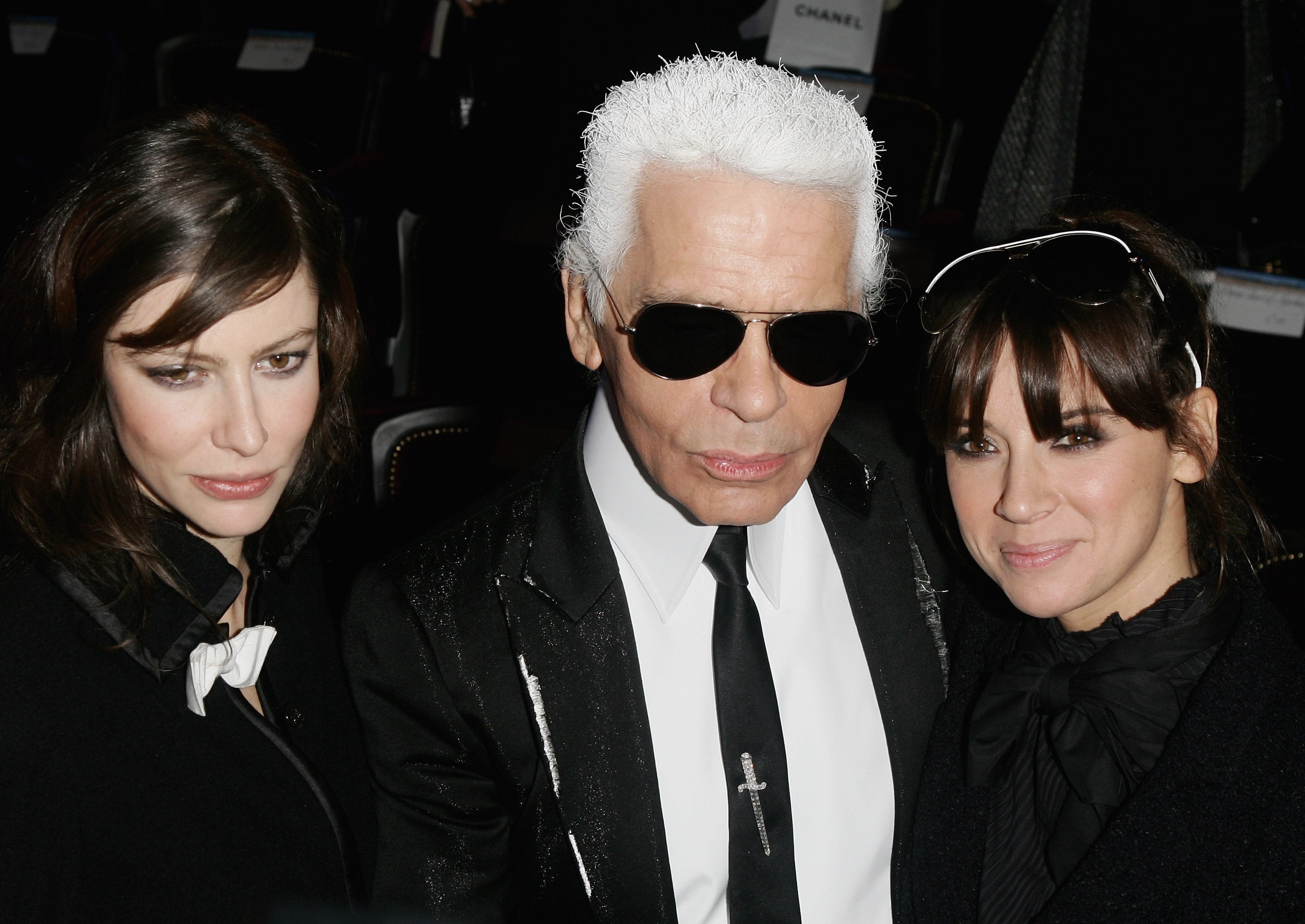 Cat Power (right) with Karl Lagerfeld and Anna Mouglalis at the Chanel Paris Monte Carlo fashion show, December 2006