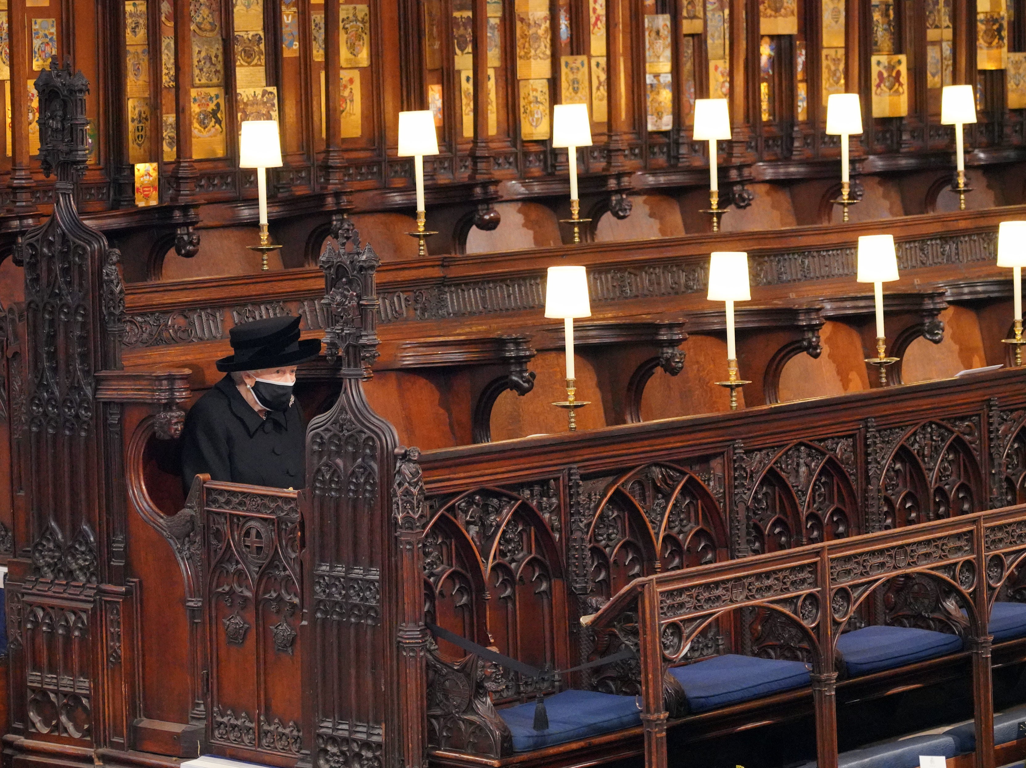 The Queen sits alone during the funeral of her husband, the Duke of Edinburgh, in St George’s Chapel, Windsor Castle, on 17 April 2021